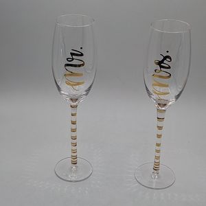 Mr and Mrs toasting glasses in package